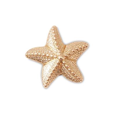 Jibbitz™ estrela do mar dourada unico