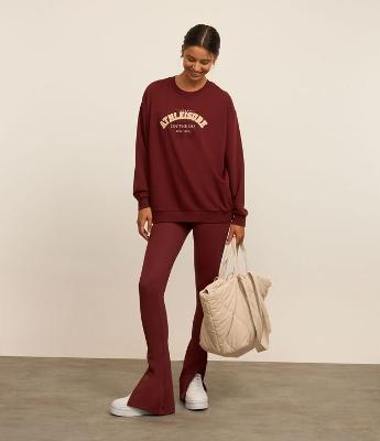 Calça Legging Flare Esportiva em Microfibra com Fenda Lateral