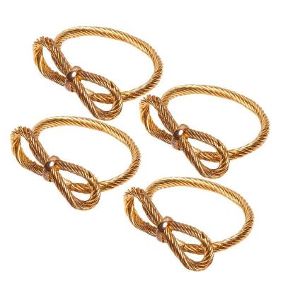 Conjunto de 4 Anéis para Guardanapos Laços em Metal Dourado Wolff