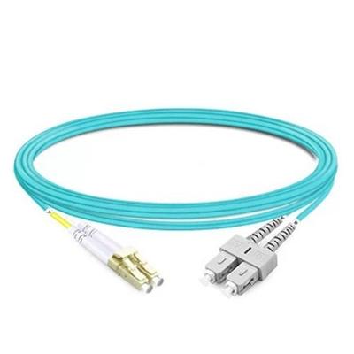 Cordão Óptico 2SC-UPC X 2LC-UPC OM3 3.0mm LSZH Duplex Multimodo 10Gbps Aqua 1,5M